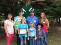 The Hendrickson family is named a 4-H century family. Pictured are (back row from left) North Dakota 4-H Foundation Board Chair Leann Schafer, Lisa Hendrickson, Kevin Hendrickson and Kari (Hendrickson) Risty, and (front row from left) Mackenzie Hendrickson, Sawyer Hendrickson and Kohl Risty.