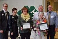 Veronica Davis (front row, right) and her daughter, Joanne Jager (front row, left) are recognized on behalf of their family, which was named a 4-H century family. The others are (from left) Chris Boerboom, NDSU Extension Service director; Donna Anderson, an Extension agent from Foster County; Brad Cogdill, director of the NDSU Extension Center for 4-H Youth Development; and Joel Lemer, an Extension agent for Foster County.