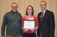 Christina Rittenbach, Extension agent, Stutsman County, receives the Myron and Muriel Johnsrud Excellence in Extension/Outreach Award from Chris Boerboom, director of the NDSU Extension Service (right), and Ron Wiederholt, southeast district director.