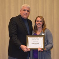 David Buchanan, associate dean for academic programs in the College of Agriculture, Food Systems, and Natural Resources, presents Rachel Richman, senior lecturer, Department of  Veterinary and Microbiological Sciences, with the H.Roald and Janet Lund Excellence in Teaching Award.