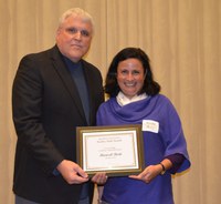 David Buchanan, associate dean for academic programs in the College of Agriculture, Food Systems, and Natural Resources, presents Marisol Berti, associate professor, Department of Plant Sciences, with the Larson/Yaggie Excellence in Research Award.