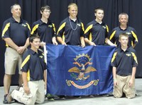 The North Dakota 4-H shooting sports team places 11th overall at the National 4-H Shooting Sports Invitational in Grand Island, Neb. Pictured are (back row, from left): Coach Greg Eider, team member alternate Blake Hensley, team members Quaid Larsen and Skyler Bitz, and Coach Jeff Ellingson; (front row, from left): team members Jacob Ellingson and Jade Ellingson.