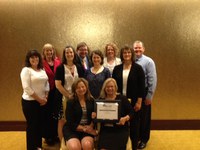 Kathy Tweeten, director of the NDSU Extension Center for Community Vitality; and Extension agents Jodi Bruns and Helen Volk-Schill are members of a tri-state team that received the first-place award in the Excellence in Teamwork category at the National Association of Community Development Extension Profesionals' conference. Picutred are (back row, from left): Charlotte Narjes of Nebraska, Dave Olson of South Dakota, Bruns and Kenneth Sherin of South Dakota; (center row): Peggy Schlechter of South Dakota, Rebecca Vogt of Nebraska, Kari O’Neill of South Dakota and Tweeten; (seated): Connie Hancock of Nebraska and Becky Bowan, former economic development director in Underwood.