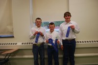 Ward County team members (from left) Thomas Schauer, Matthew Schauer and Jacob Scheresky win first place in the intermediate division of the state 4-H meat judging contest at NDSU.