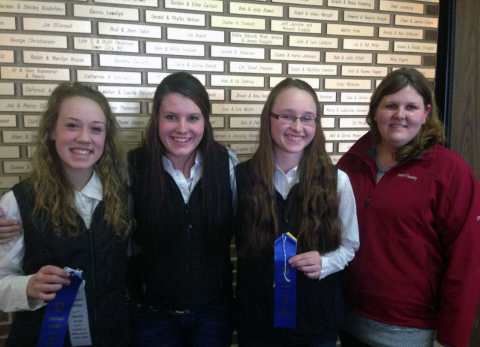 Members of the Ward County 4-H hippology team display the ribbons they received for taking first place in the senior division of the hippology contest at the North Dakota Winter Show. Pictured  (from left) are team members Shaylee Miller, Parker Bush and Kara Scheresky, and coach Paige Brummund. (Not pictured is team member Lindsey Sys.)