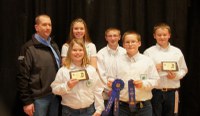 The Ransom County team placed first in the junior division of the 4-H livestock judging contest at the North Dakota Winter Show. Pictured are (from left, front row) Jamie Geyer and Jacob Bear and (back row) coach Brian Zimprich and team members Kaitlin Geyer, Garrett Oland and Zach Bear.