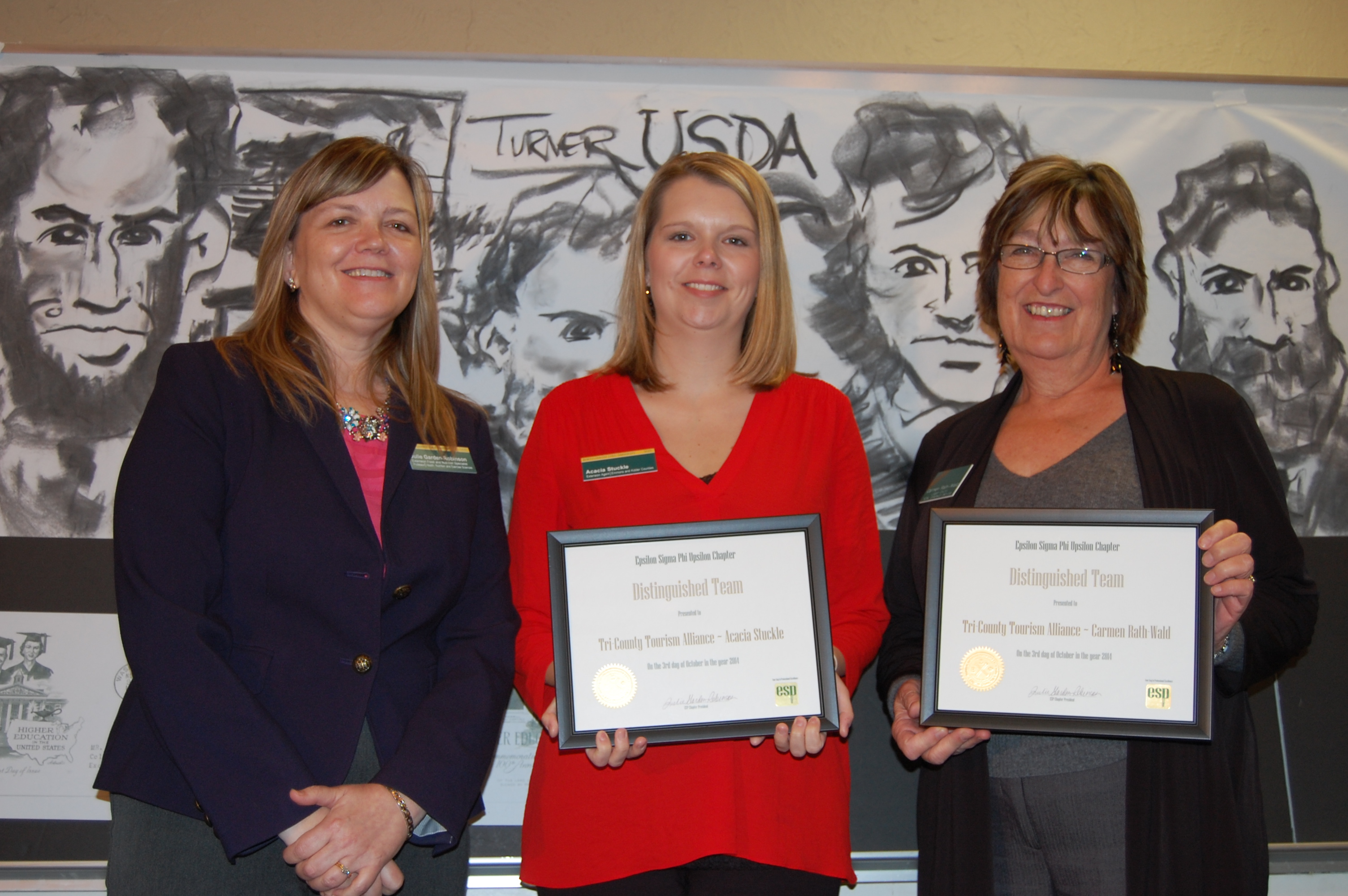 Acacia Stuckle, center, and Carmen Rath-Wald