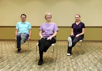 These adults are practicing some stretching exercises to strengthen their muscles and improve their flexibility. The exercises are part of the Nourish Your Muscles lesson in the NDSU Extension Service's Nourishing Boomers and Beyond Program. (NDSU photo)