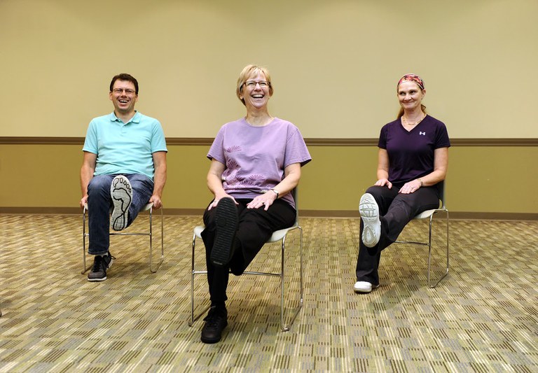 These adults are practicing some stretching exercises to strengthen their muscles and improve their flexibility. The exercises are part of the Nourish Your Muscles lesson in the NDSU Extension Service's Nourishing Boomers and Beyond Program. (NDSU photo)