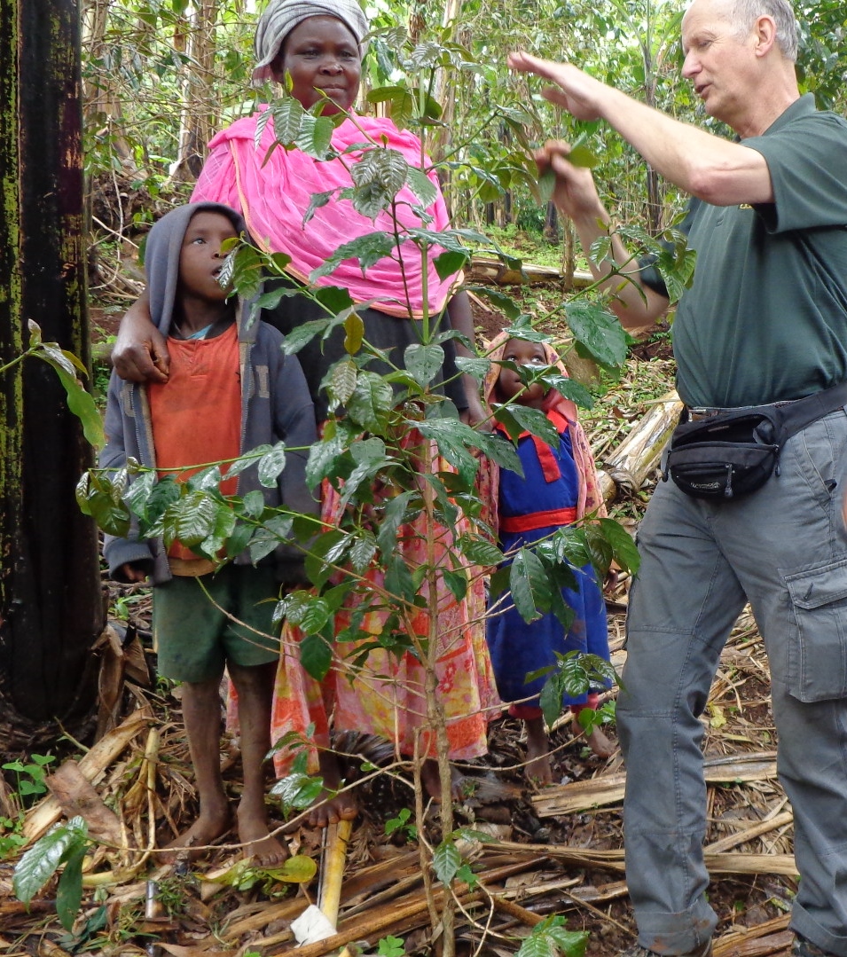 NDSU Extension agronomist Hans Kandel explains pruning to coffee growers in Uganda. (NDSU photo)