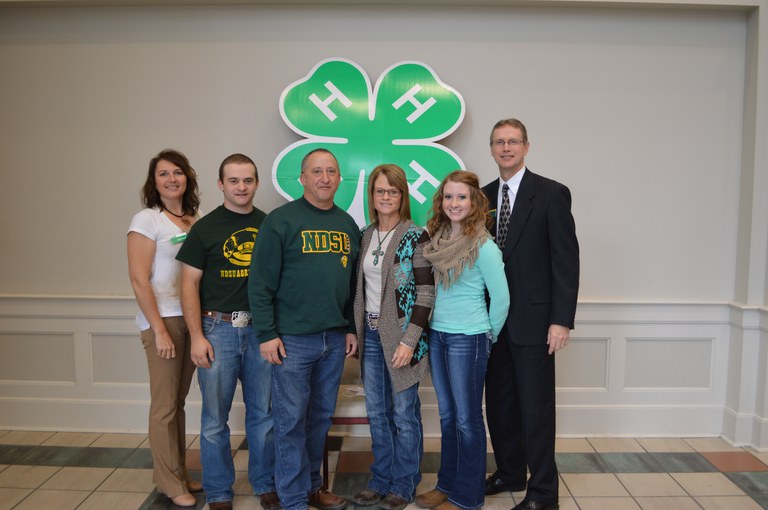 The Mitchell Leier family was named a North Dakota 4-H century family. Picutred are, from left, Leann Schafer, chairwoman of the North Dakota 4-H Foundation board; Justin Leier; Mitch Leier; Doris Leier; Angela Leier; and Chris Boerboom, NDSU Extension Service director. (NDSU photo)