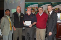 Roald Lund, Ken Dalsted and Don Giffey (left to right)  accept the award on behalf of the N.D. Rural Rehabilitation Corporation.