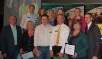Patrick Sitter, general manager, Farm and Ranch Guide, and Chris Boerboom, NDSU Extension Service director, present a Program Excellence Award to this team for its development of the Communication Camp. Pictured are (front row, left to right) Sitter; Linda McCaw, administrative assistant, Agriculture Communication; Bob Bertsch, Web technology specialist, Agriculture Communication; Bruce Sundeen, electronic media specialist, Agriculture Communication; Ellen Crawford, information specialist, Agriculture Communication; Boerboom; (back row, left to right) Scott Swanson, electronic media specialist, Agriculture Communication; Sonja Fuchs, Web technology specialist, Agriculture Communication; Susan Finneseth, program manager, EFNEP and Family Nutrition Program; Stacy Wang, Extension associate, Health, Nutrition and Exercise Sciences; Becky Koch, director, Agriculture Communication. (NDSU photo)