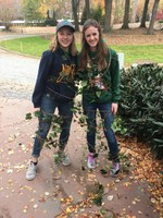 North Dakota 4-H'ers Marit Wang, left, and Avery Breiland remove an invasive species of ivy at the Atlanta History Museum as a community service project that was part of the National 4-H Congress activities. (NDSU photo)