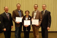 NDSU Extension staff were honored for their work during the 25th annual Agriculture and Extension Faculty/Staff Awards program Dec. 8. Pictured are, from left, NDSU President Dean Bresciani, beef cattle specialist Carl Dahlen, Distribution Center manager Sharon Lane, potato agronomist Andrew Robinson and Extension Service Director Chris Boerboom. (NDSU photo)