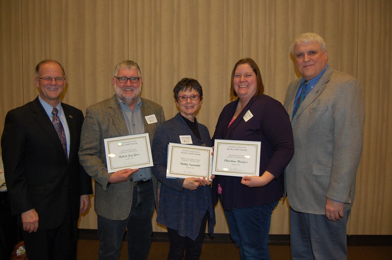 NDSU faculty were honored for their teaching and advising during the 25th annual Agriculture and Extension Faculty/Staff Awards program Dec. 8. Pictured are, from left, NDSU President Dean Bresciani; R.Jay Goos, professor, School of Natural Resource Sciences (Soil Science); Shelly Swandal, student services director, Department of Agribusiness and Applied Economics; Christina Hargiss, assistant professor, School of Natural Resource Sciences (Natural Resources Management); and David Buchanan, associate dean for academic programs in the College of Agriculture, Food Systems, and Natural Resources. (NDSU photo)