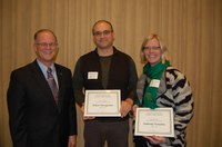 NDSU researchers were honored during the 25th annual Agriculture and Extension Faculty/Staff Awards program Dec. 8. Pictured are, from left, NDSU President Dean Bresciani; Robert Brueggeman, associate professor, Department of Plant Pathology; and Kimberly Vonnahme, professor, Department of Animal Sciences. (NDSU photo)