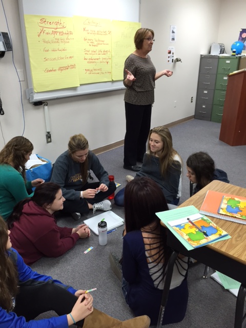 Tenth-graders participating in the Stronger Communities Together program tackle community challenges with assistance from Carmen Rath-Wald, an Extension agent in Logan County. (NDSU photo)