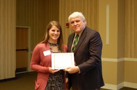 Loren Baranko receives the Earl and Dorothy Foster Excellence in Teaching Award from David Buchanan, associate dean for academic programs. (NDSU photo)