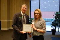 Miranda Meehan receives the Myron and Muriel Johnsrud Excellence in Extension/Outreach Award from NDSU Extension Director Chris Boerboom. (NDSU photo)
