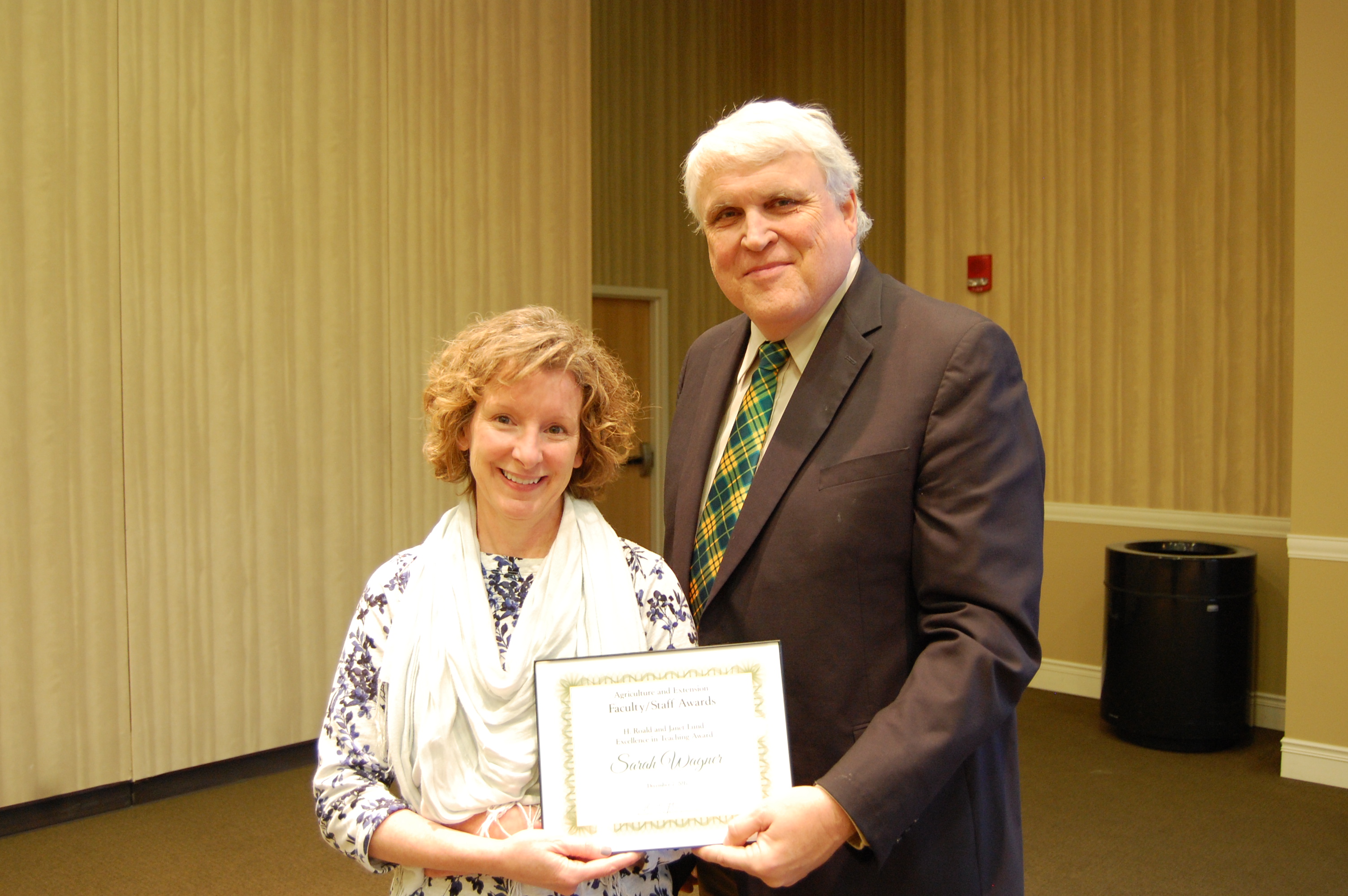 Sarah Wagner receives the H. Roald and Janet Lund Excellence in Teaching Award from David Buchanan, associate dean for academic programs. (NDSU photo)