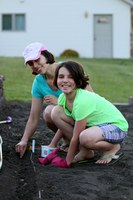 A North Dakota family plants seeds in their home garden to help test new varieties. (NDSU Photo)