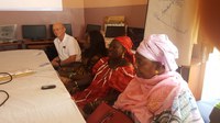 Ransom exchanges information with women's groups while volunteering in Senegal. (NDSU Photo)