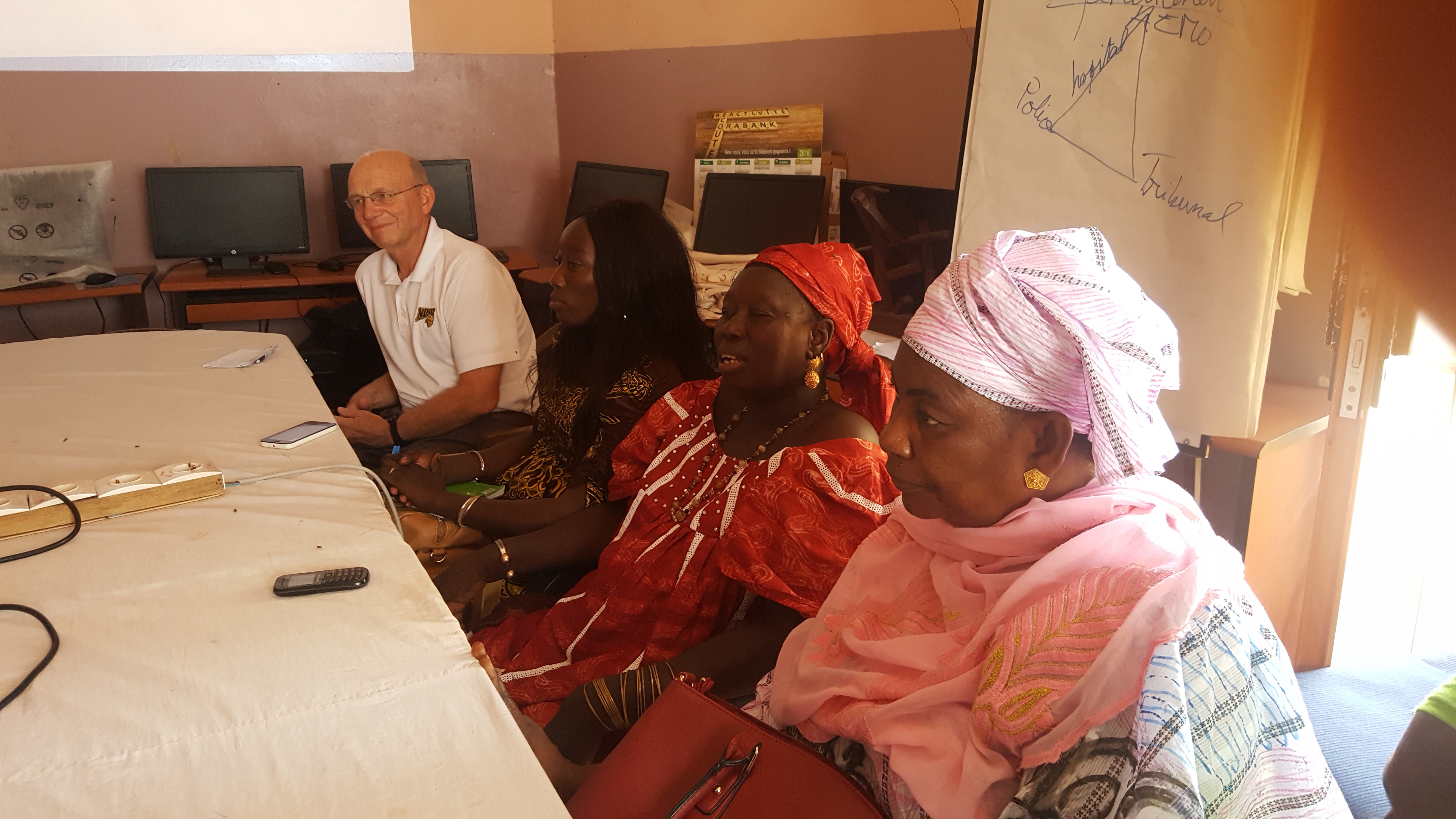 Ransom exchanges information with women's groups while volunteering in Senegal. (NDSU Photo)