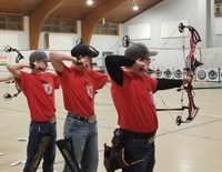 Ward County team members (from left) Kaden Korgel, Tate Novodorsky and Ethan Myers take aim in the senior freestyle division of the 4-H Archery Indoor Championships in Edgeley. (NDSU photo)