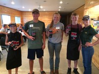 The Richland County team of (from left) Greyson Matejcek, Gunnar Miller, Sherilyn Gutzmer and Mason Miller took first place in the senior division of 4-H Grill-off. Leigh Ann Skurupey, NDSU Extension 4-H youth development specialist for animal sciences, is on the right. (NDSU photo)