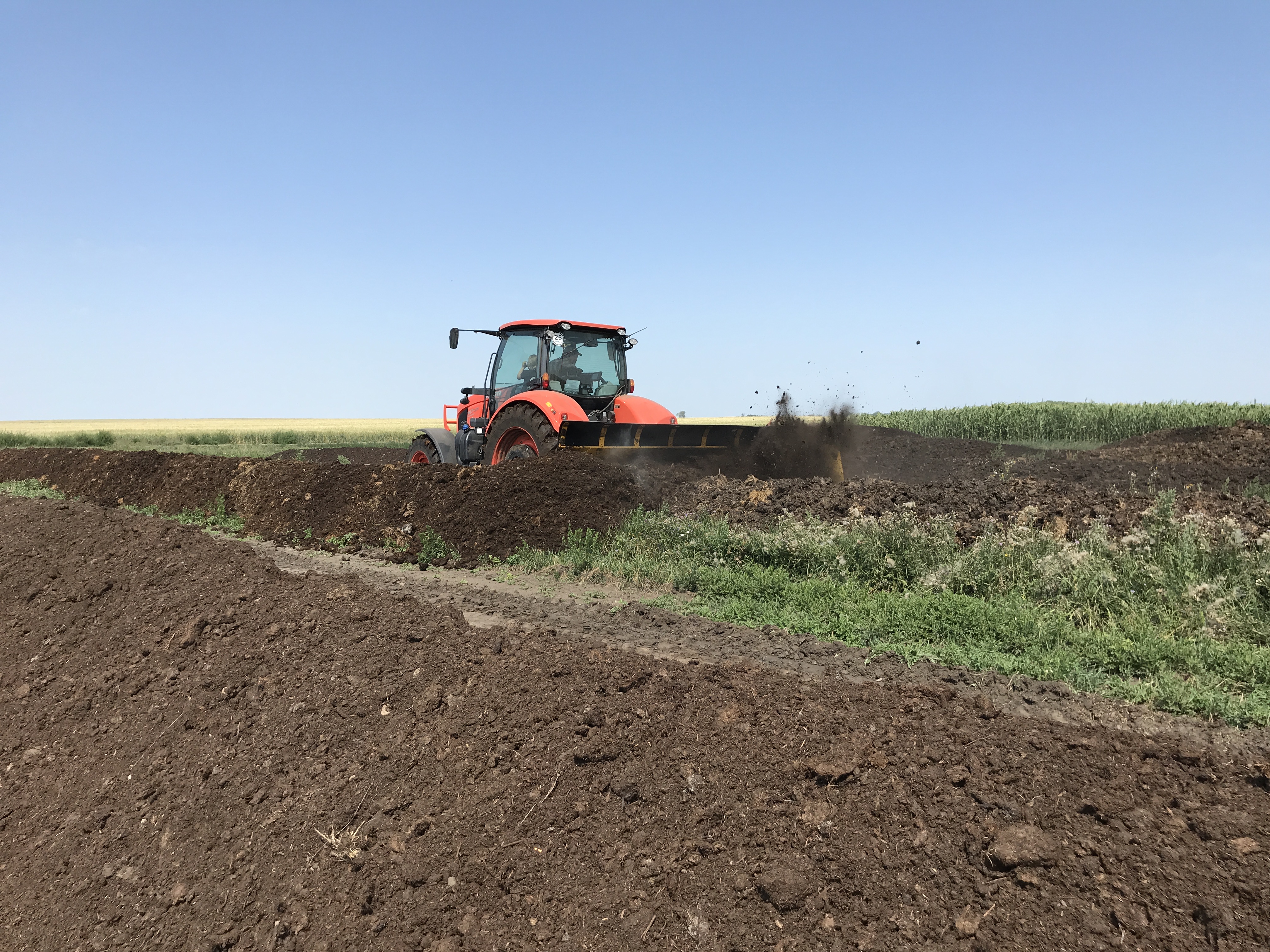 Carpio-area producer Monte Bloms turns compost rows in preparation for the Manure Compost Demo Day. (NDSU photo)