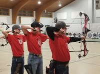 The Ward County archery team of (from left) Kaden Korgel, Tate Novodvorsky and Ethan Myers competes at the Minot Northwest District match. (NDSU photo)