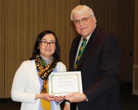 Siew Hoon Lim, left, receives the H. Roald and Janet Lund Excellence in Teaching Award from David Buchanan, associate dean for academic programs. (NDSU photo)