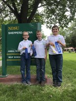 The Stark-Billings County team takes first place in the junior division of the State 4-H Meat Judging Contest. Team members are (from left): Mark Schmidt, Joel Schulz and Ryan Schumacher. (NDSU photo)