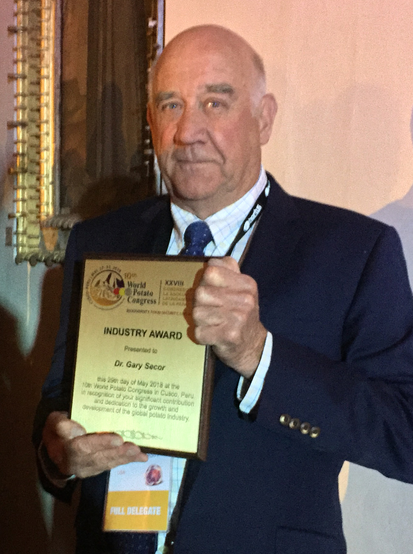 Gary Secor, a professor in NDSU's Plant Pathology Department, receives the 2018 Industry Award from the World Potato Congress. (NDSU photo)