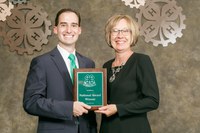 Deb Lee receives the Meritorious Service Award from Casey Mull, NAE4-HA president. (Photo courtesy of NAE4-HA)