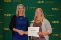 Alicia Harstad, right, receives an Extension Program Excellence Award. (NDSU photo)
