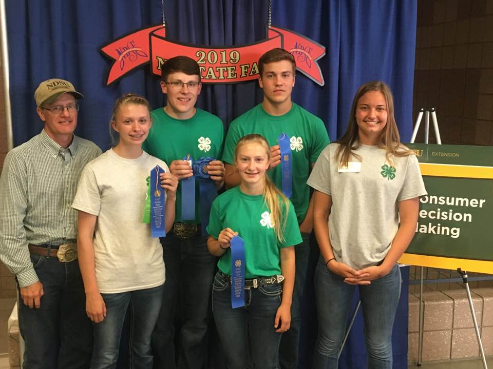 1st Place Senior Team – Oliver County Pictured left to right: Rick Schmidt (Oliver County – NDSU Extension agent and coach) and team members Morgyn Miller, Jacob Klaudt, Charlie Liffrig, Breanna Vosberg (representing Oliver County, placed 9th overall in the individual contest) and Reanna Schmidt, member of the 1st place team. (NDSU Photo)