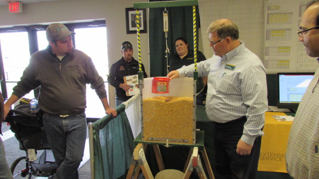 Ken Hellevang, NDSU Extension agricultural engineer (right), talks to Big Iron visitors about grain bin safety. (NDSU photo)
