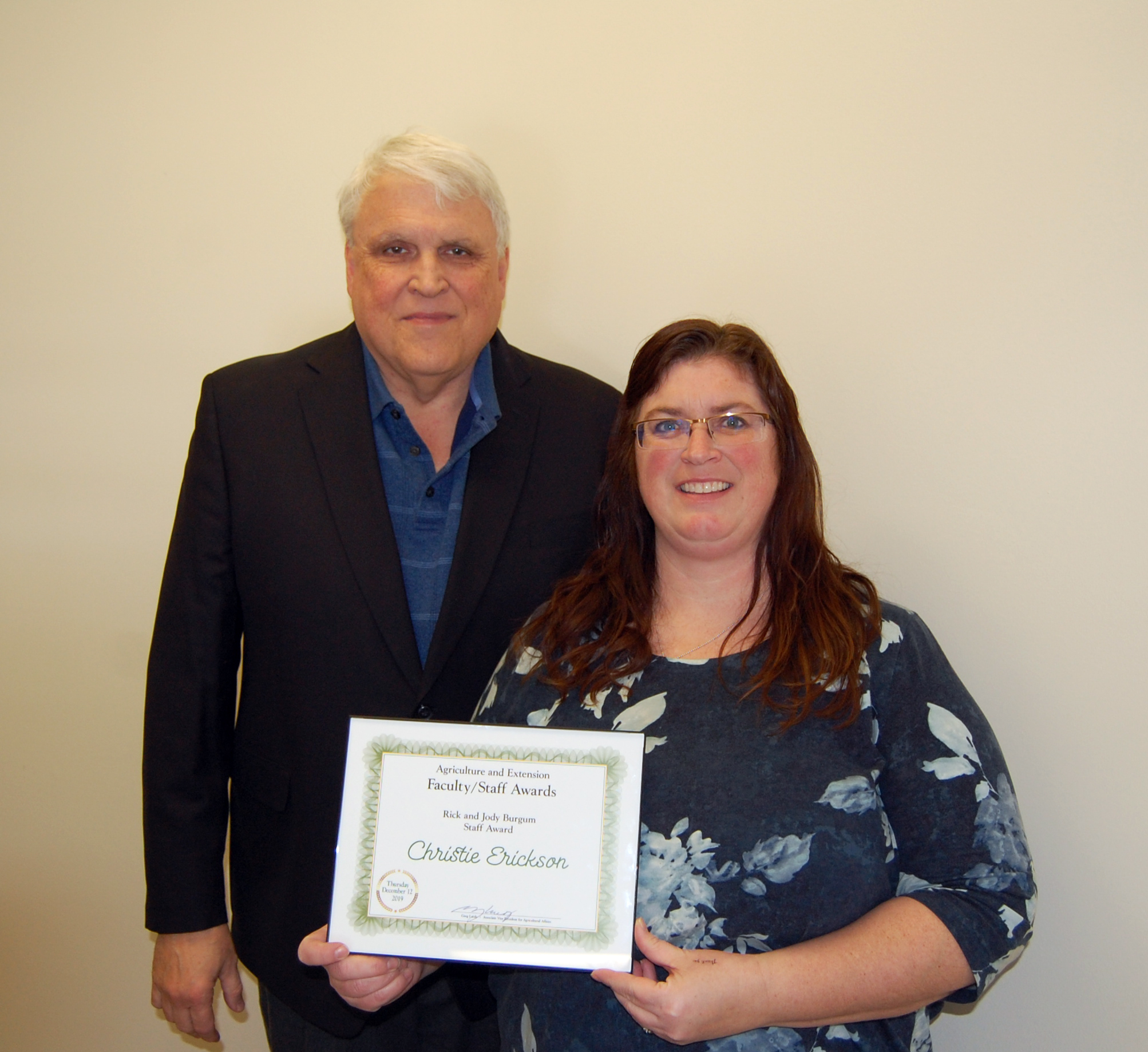 Christie Erickson, right, receives the Rick and Jody Burgum Staff Award from David Buchanan, associate dean for academic programs. (NDSU photo)