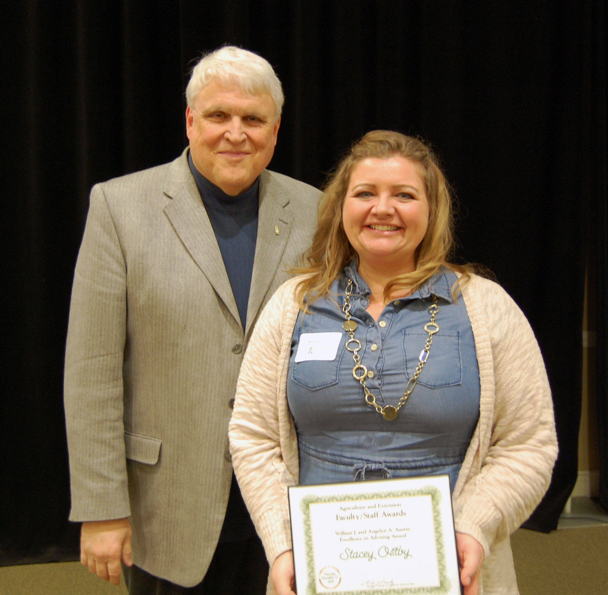 Stacey Ostby, right, receives the William J. and Angelyn A. Austin Excellence in Advising Award from David Buchanan, associate dean for academic programs. (NDSU photo)