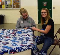 4-H youth make a blanket for the LEO's Blanket Project during the recent Leadership Awareness Weekend, a 4-H civic engagement event. (NDSU photo)
