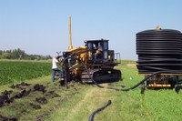 A crew installs a tile drainage system. (NDSU photo)