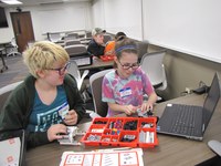 Youth build and program robots during a pilot after-school 4-H robotics program in McKenzie County. (NDSU photo)