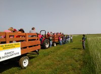 Participants at a past DREC field day tour learn about research being conducted at the center. (NDSU Photo)