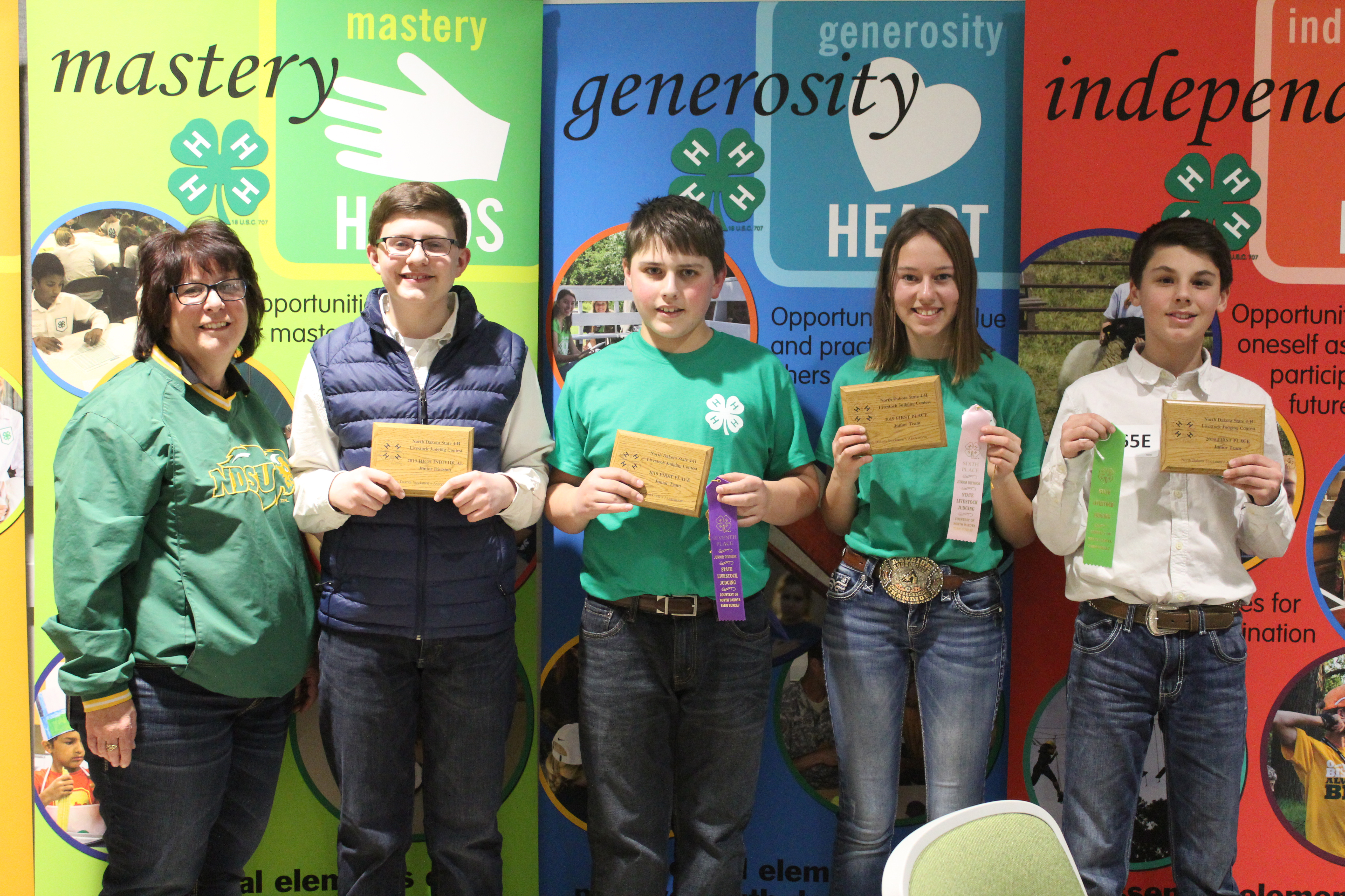 The Morton County team took first place in the junior division of the North Dakota State 4-H Livestock Judging Contest. Pictured are (from left): coach Jackie Buckley and team members Ty MacDonald, Karsten Peterson, Medora Ellingson and Grant Hauge. (NDSU photo)