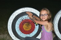 A youth pulls an arrow from a target during an archery camp at the North Dakota 4-H Camp near Washburn. (NDSU photo)