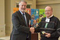 Wayne Hankel (right) is inducted into the North Dakota 4-H Hall of Fame. Also pictured is Lyndon Anderson, a North Dakota 4-H Foundation board member. (NDSU photo)