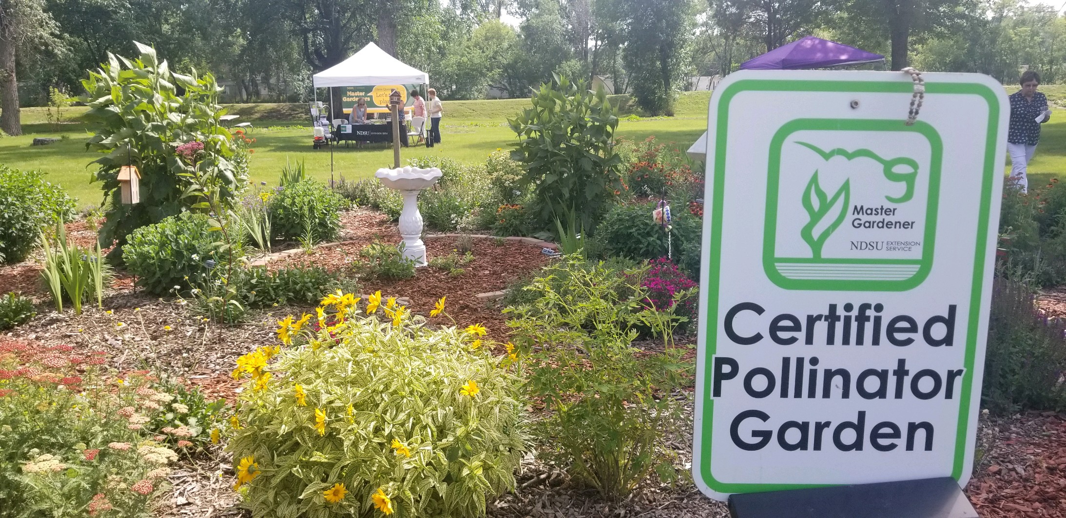 Visitors stop at the NDSU Extension Master Gardeners booth during a horticultural tour. (NDSU photo)