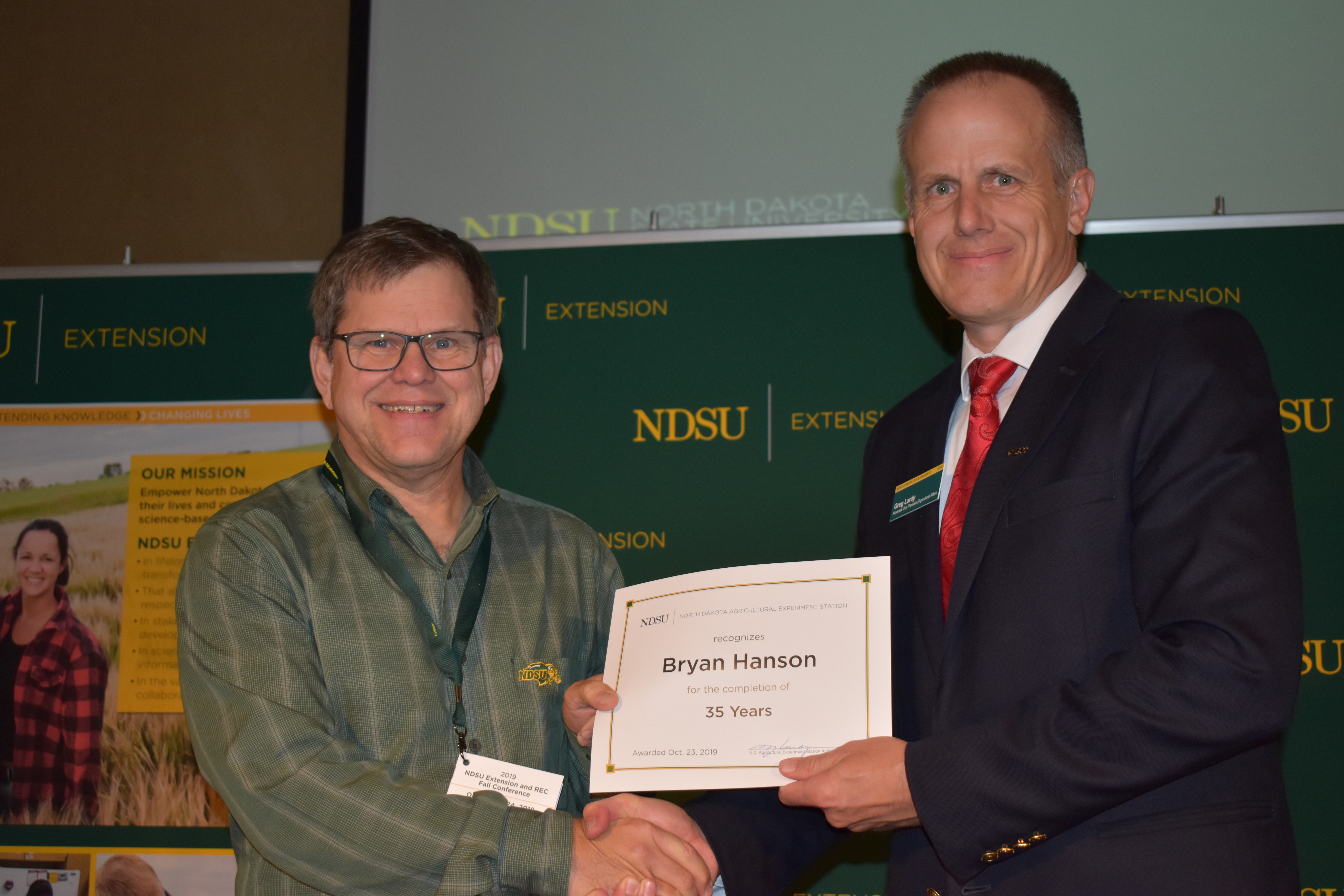 Bryan Hanson, research agronomist, is honored for his 35 years of service to the Langdon Research Extension Center.